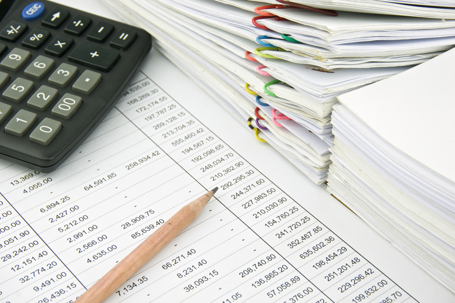 Law firm financial documents with calculator and reports