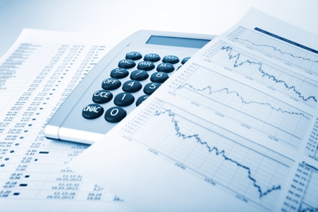 Financial data sheets and calculator illustrating steps in creating a financial forecast for growing firms.