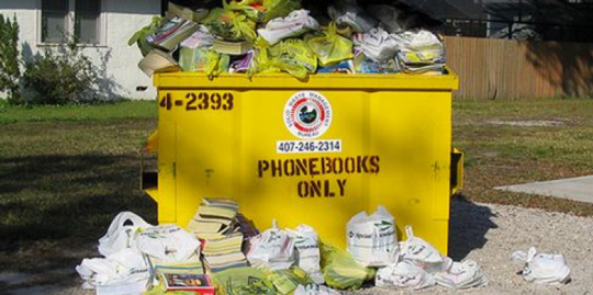 a dumpster full of phone books