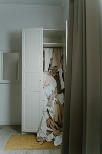 A messy, over-stuffed linen closet shows how firms can have a lot of expenses that are easy to miss.